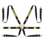 Grand Prix Racewear safety harness with black and yellow straps, designed for motorsport safety and driver protection.