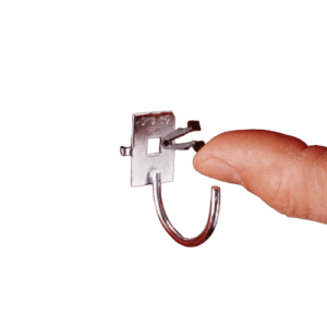 Close-up of a person holding a Facom locking clip CKLA, a small metal fastener used in automotive and industrial applications.