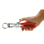 Grand Prix Racewear self-tightening clamp pliers DM.29 held in a person's hand, showcasing their ergonomic design and compact size.