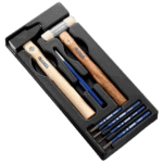 Set of 7 shock tools with wooden and plastic handles in a black foam insert for precise automotive repairs.