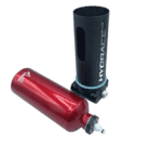 Hydraulic suspension components for Grand Prix racewear, featuring a red nitrogen gas shock absorber and a black carbon fibre cylinder for high-performance motorsport use.
