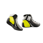 High-performance Grand Prix racing shoes with black, yellow, and white design for professional motorsport drivers.