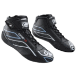 High-performance OMP racing shoes designed for motorsport, featuring black synthetic material with white and blue accents, and a secure Velcro strap for optimal fit.