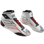 High-performance Grand Prix racing shoes with white, black, and red design, featuring OMP branding and advanced safety features for motorsport drivers.