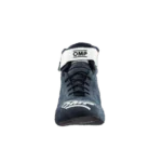 Close-up of a Grand Prix racing shoe by OMP, designed for motorsport safety and performance, featuring a sleek black and white design.