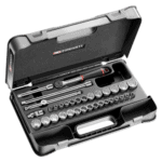 Facom 34-piece 3/8" metric and inch 12-point socket set in a black case with various sockets and tools.
