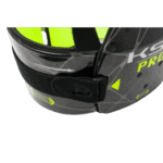 Close-up of a Grand Prix Racewear helmet with black and neon yellow design, featuring adjustable strap and ventilation.