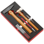 Facom impact tools set with hammer, chisel, and accessories in a black and red foam case for professional use.