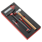 Facom impact tools set with drift punches, hammer, and accessories in foam packaging for precision work.