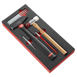 Facom impact tools set with drift punches, hammer, and accessories in foam packaging for precision work.