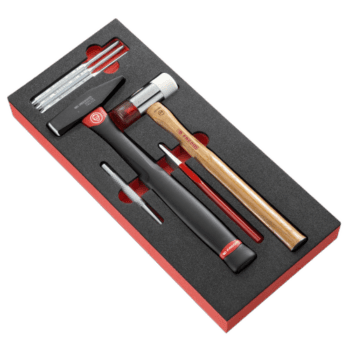 Facom impact tools set with drift punches, hammer, and accessories in foam packaging for precision work.