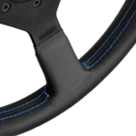 Close-up of a racing steering wheel with black leather and blue stitching, showcasing high-quality Grand Prix Racewear craftsmanship.