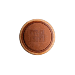 Close-up of a round wooden token with the number 88 engraved on it, used in motorsport events.