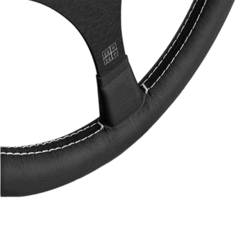 Close-up of a black racing steering wheel with white stitching, designed for motorsport performance and durability.