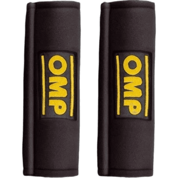 Pair of OMP racing safety harness pads in black with yellow OMP logo for motorsport safety gear.