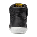 Close-up of a black Grand Prix Racewear motorcycle boot with yellow interior detail, showcasing durable leather construction and high ankle support.