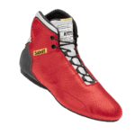 Red Sabelt racing shoe with black and white laces, designed for motorsport safety and performance.