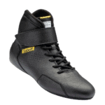Black Sabelt racing shoe with Velcro strap and yellow logo, designed for motorsport safety and performance.