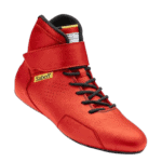 Red Sabelt racing shoe with black laces and ankle support, designed for motorsport safety and performance.