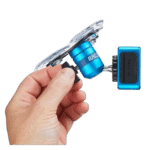 Close-up of a hand holding a blue action camera mount with a GoPro-style camera attached, suitable for motorsport recording.