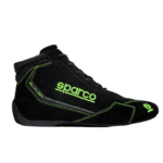 Black Sparco racing shoe with neon green accents and branding, designed for motorsport safety and performance.