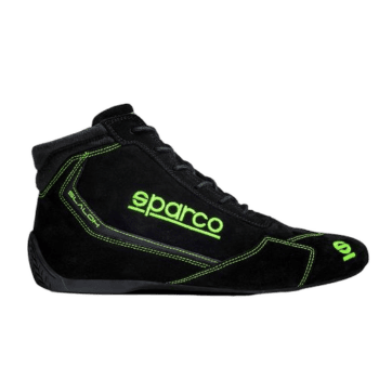 Black Sparco racing shoe with neon green accents and branding, designed for motorsport safety and performance.