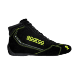 Black Sparco racing shoe with yellow accents and branding, designed for motorsport safety and performance.