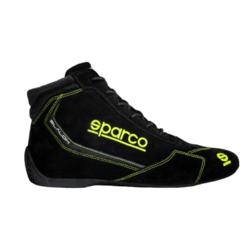 Black Sparco racing shoe with yellow accents and branding, designed for motorsport safety and performance.