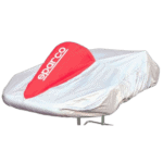 Grand Prix Racewear branded car cover in white with red logo, protecting a racing vehicle.