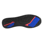 Close-up of a racing shoe sole with black, red, and blue rubber grip patterns for motorsport safety and performance.