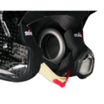 Close-up of a racing helmet with a built-in communication speaker and visor, showcasing high-quality safety gear for motorsport enthusiasts.