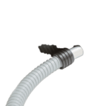 Close-up of a high-performance racing spark plug with a white cable, used in motorsport vehicles for optimal ignition.