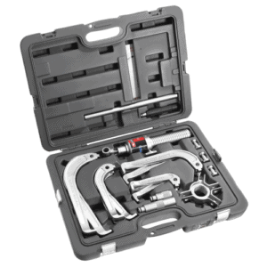 Facom hydraulic puller set with multiple tools and accessories in a black carrying case for outside pulling tasks.