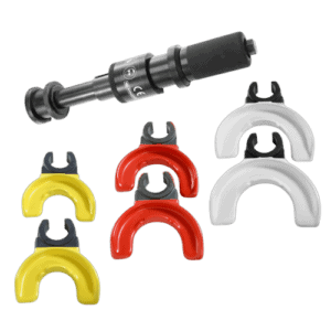 Universal spring compressor with interchangeable forks in red, yellow, and white for automotive suspension work.