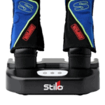 Stilo racing gloves on a charging station, designed for motorsport safety and performance.