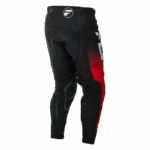 Fly Racing Evolution 2026 DST Bottoms motocross riding pants in black with red and white accents, designed for off-road motorcycle racing.