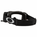 Oakley MX goggles with Tuff Blocks roll-off system for motocross racing, featuring a black frame and adjustable strap.