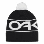 Oakley Factory Cuff Beanie in black and white with pom-pom, featuring bold Oakley logo, ideal for motorsport fans and winter wear.