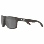 Oakley Sylas Moto GP sunglasses with a sleek black frame and grey tinted lenses, designed for high-performance motorcycling.