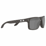 Oakley Sylas Moto GP sunglasses with a dark woodgrain finish and grey lenses, designed for motorcycle racing enthusiasts.