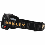 Oakley MX goggles with black strap and gold logo, designed for motocross riders.