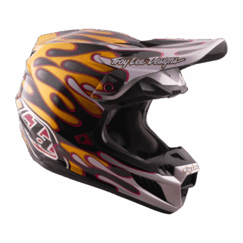 Troy Lee Designs SE5 Carbon Overspray helmet with flame graphics in black, yellow, and pink, featuring the Troy Lee Designs logo.
