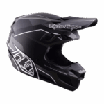 Troy Lee Designs SE5 Polycarbonate Stand Helmet in black with white graphics, designed for motocross and off-road racing.
