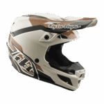 Troy Lee Designs SE5 Polycarbonate Stand Helmet in white with brown and black accents, featuring aerodynamic design and branding for motocross safety.