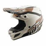 Troy Lee Designs SE5 Polycarbonate Stand Helmet in white with black and brown accents, featuring aerodynamic design and branding for motocross safety.